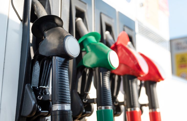 Petrol pump filling nozzles. Fuel at gas station close up